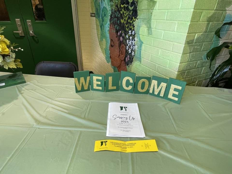 Welcome table at Uptown 8th Grade Stepping Up Ceremony