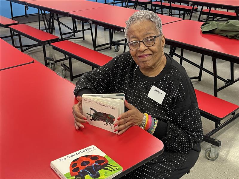 Atlantic City Board of Education member Ruth Byard shares books at Texas Avenue School.