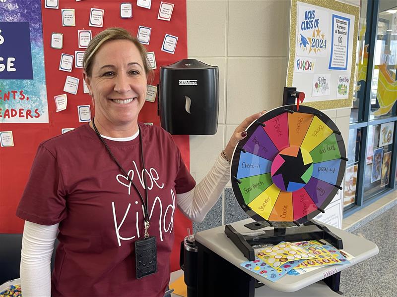Kerri Harvey, Teacher Coordinator from Atlantic City High School, verifies completion at Random Acts of Kindness station.