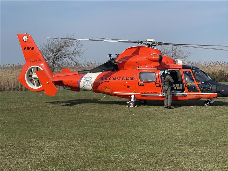 Orange U.S. Coast Guard helicopter lands at Atlantic City High School