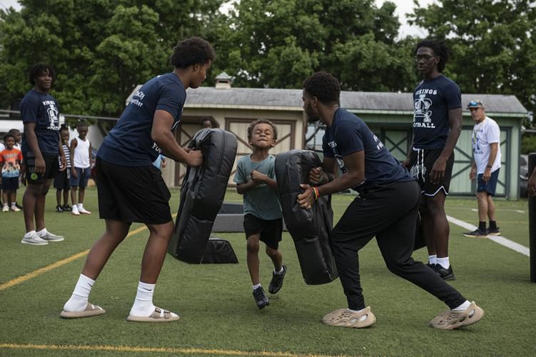  Football players with Dolphin athlete